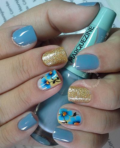 unhas decoradas azul e dourado