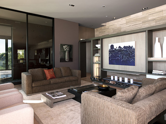 Photo of modern luxury house interiors with brown furniture and dark brown walls