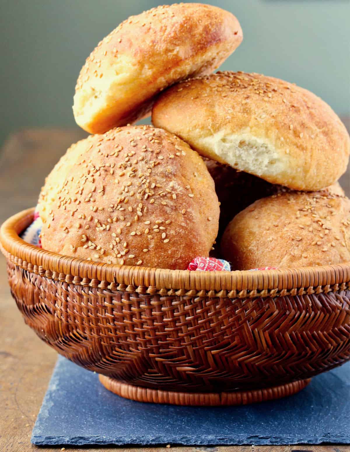 Mexican Cemita Rolls stacked in a bread basket.
