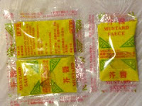 Packets of mustard sauce.