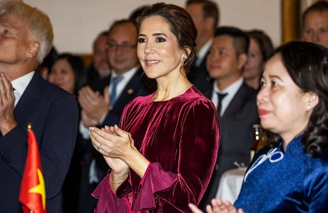 Crown Princess Mary wore a Yahvi cherry velvet dress by Beulah London. Vietnam's Vice President Vo Thi Anh Xuan