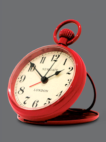 red alarm clock, designed to look like a pocket watch