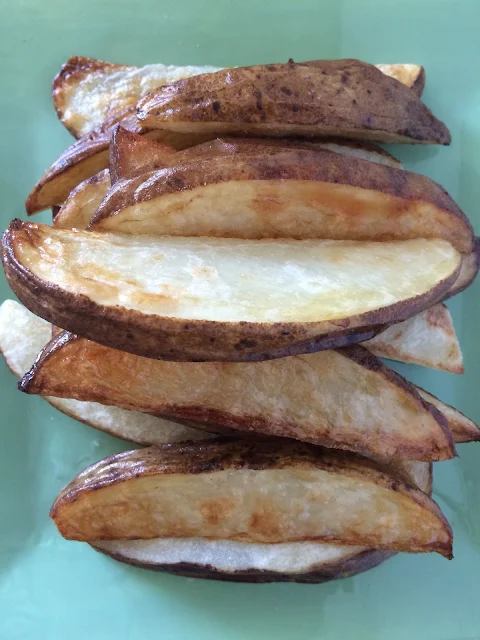 Close-up of finished roasted potato wedges.