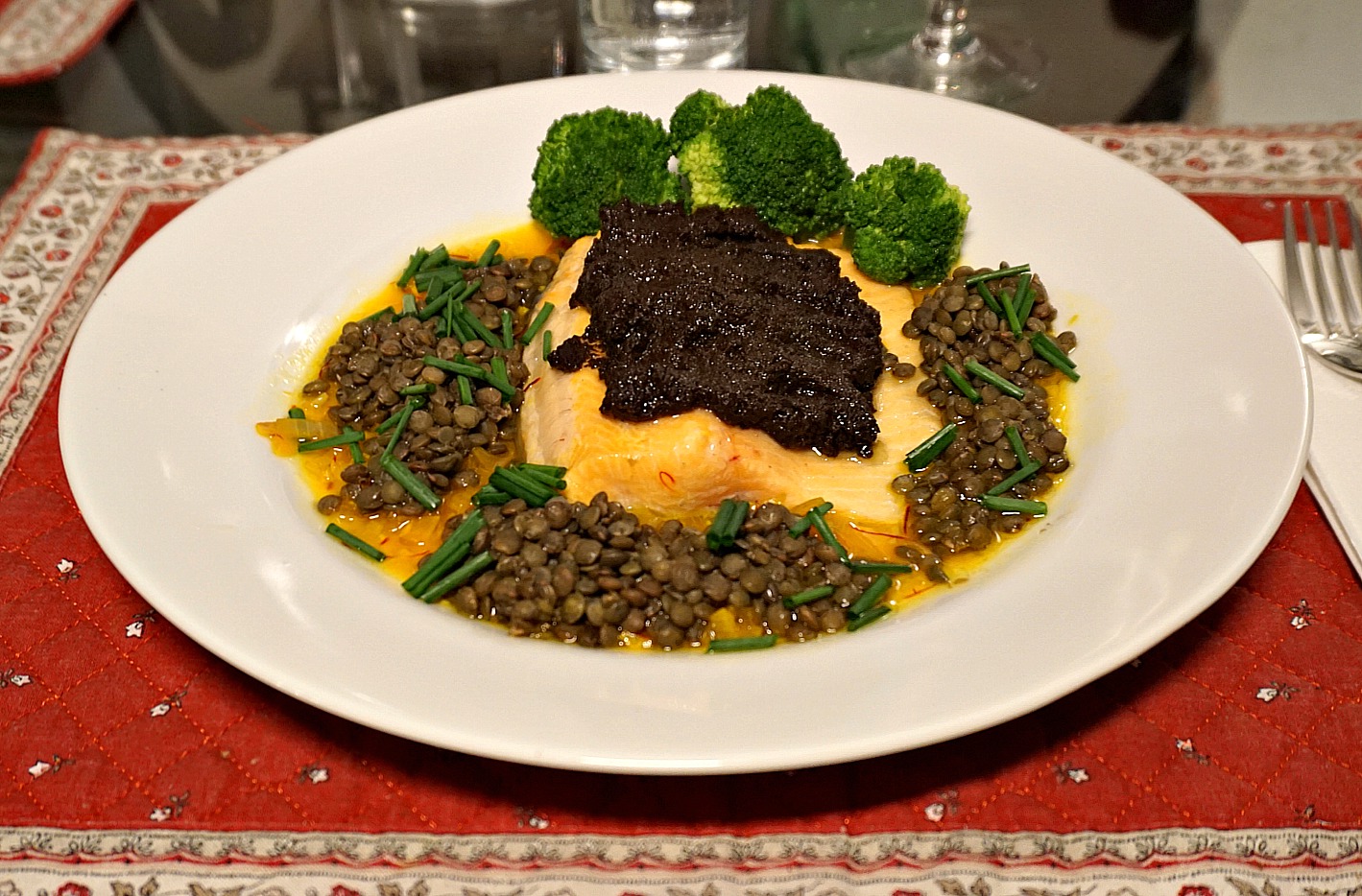 Trout with tapenade, lentils, and saffron sauce