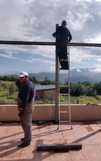 Sally up a ladder getting string