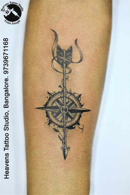 http://heavenstattoobangalore.in/arrow-with-compass-tattoo-at-heavens-tattoo-studio-bangalore/