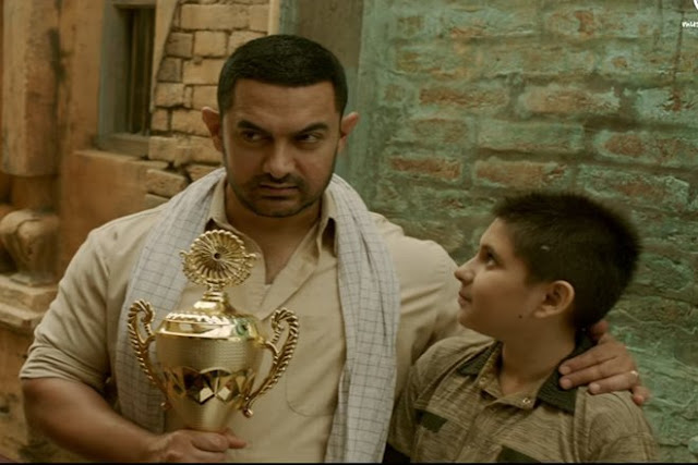 Aamir Khan and Zaira Wasim as Mahavir and Geeta Phogat (young)