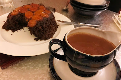 Chocolate pudding with apricots and chocolate sauce