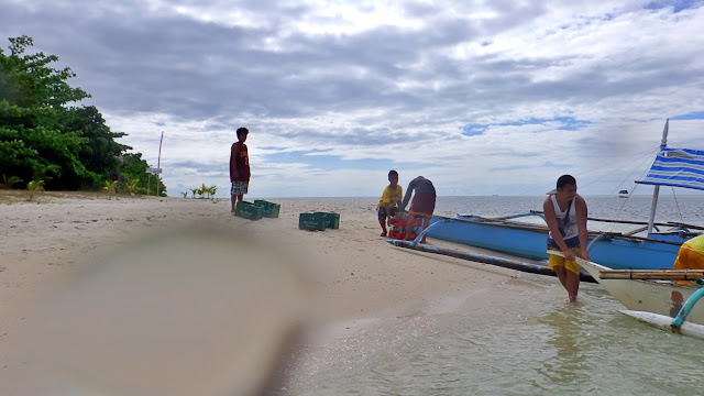 supplies being delivered to the beach of Canigao Island, Matalom Leyte