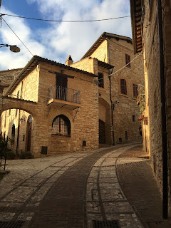 Climbing the steep cobble streets of Spello, Umbria, Italy