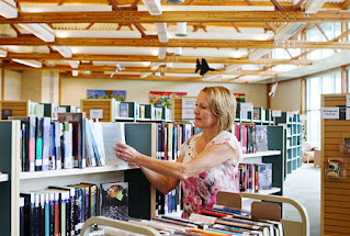 A hard working librarian working at a local library.