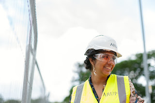 a smiling construction woman | Debt collection agency Grand Rapids