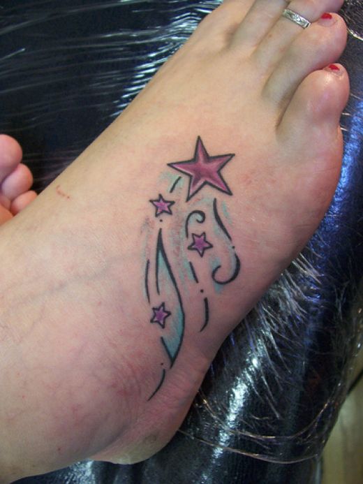 flower and star tattoos on foot. Shooting stars artwotk.
