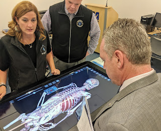 State Rep Jeff Roy in one of the UMass Medical classroom with an interactive system of the body