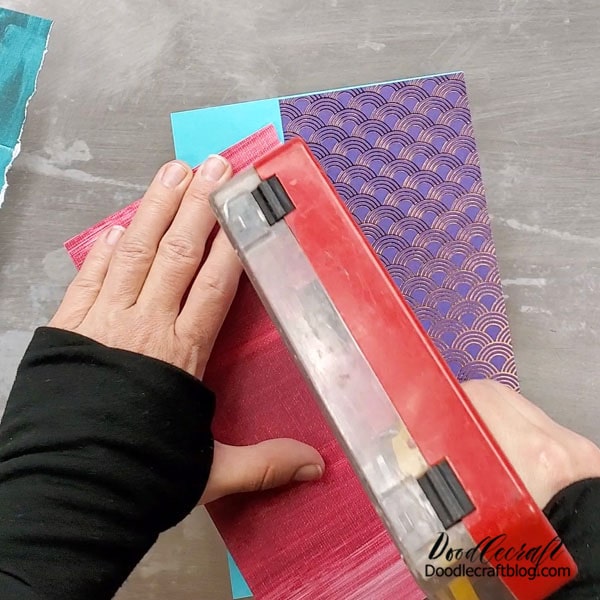 Use a tape runner to very heavily tape all the pieces together. If they are not super secure, right to the edges, the book cover will lift apart.