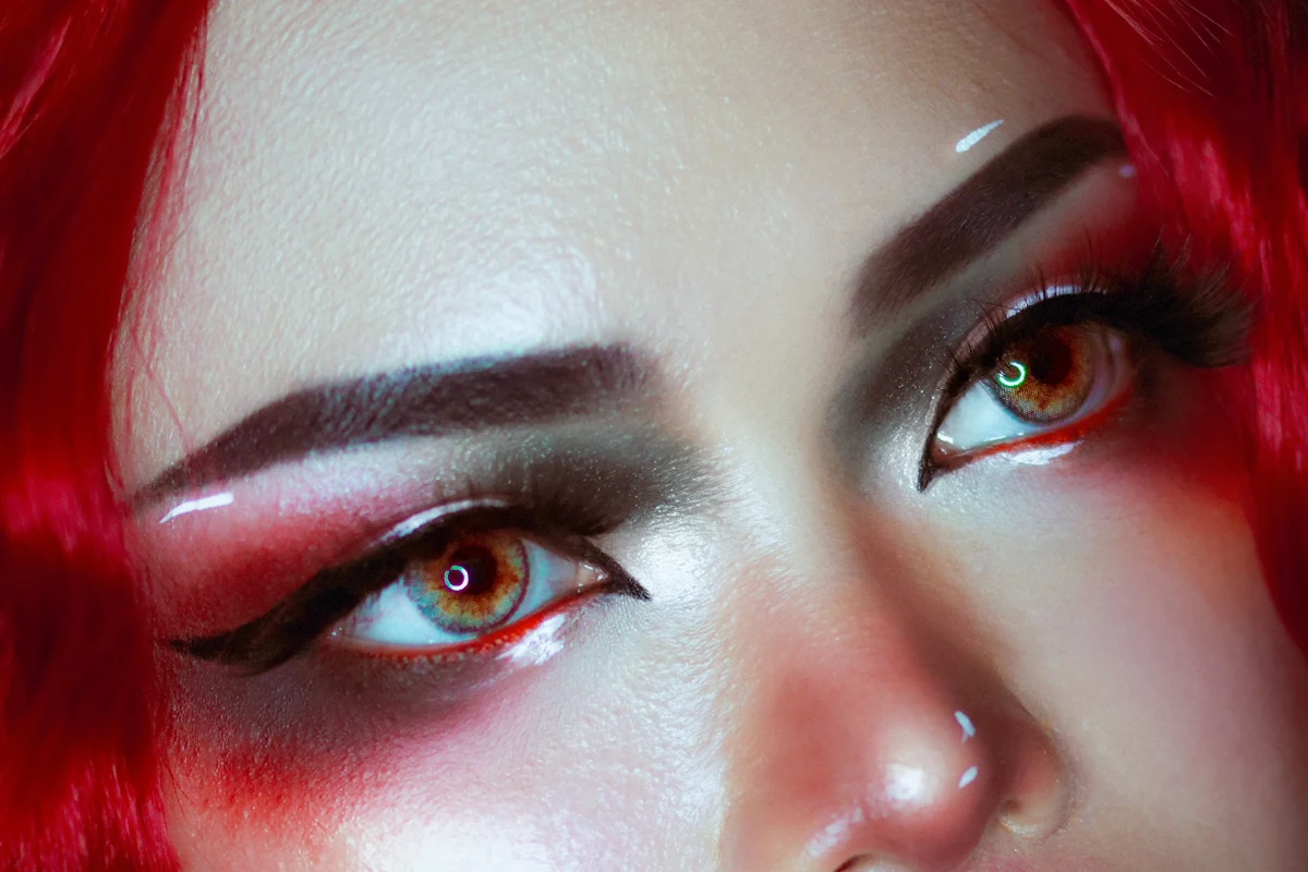 close-up selfie of a beautiful woman with reg goth makeup look