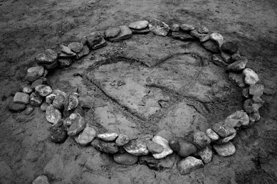 Heart surrounded by stones guillaume lelasseux 2009