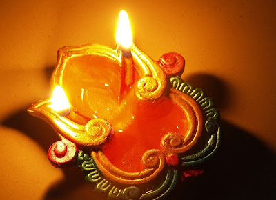 oil lamp symbolizing sacred connection to the seasons and maintaining balance through seasonal changes with Ayurveda