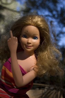 Barbie giving the middle finger