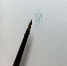 splayed hairs on a winsor and newton paint brush