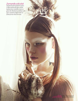 model wearing feathers, vogue beauty photographer, festival makeup