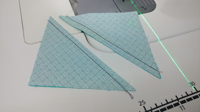 Using a sewing machine laser to sew half square triangles