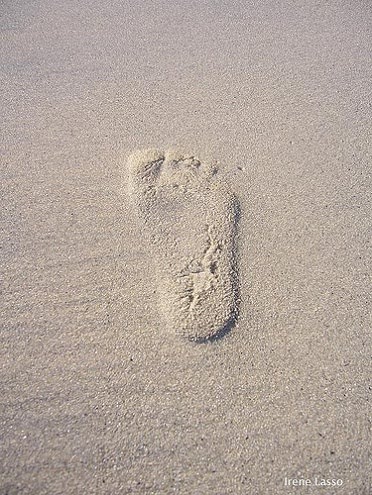 baby footprints tattoo. Tiny red aby footprint