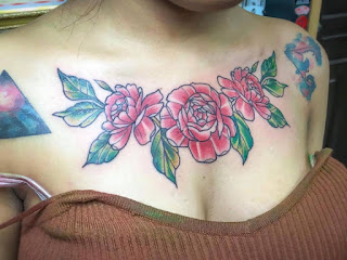 Flower tattoo before peeling off into girl's skin