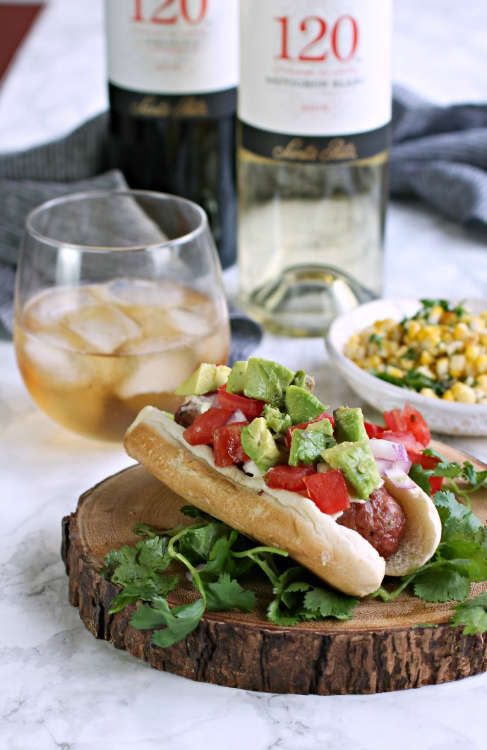 Recipe for a loaded hot dog sandwich with Latin flavors and a roasted corn.