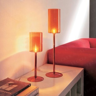 The cup-shaped table lamps with shades made of blown glass bathe the room in warm light