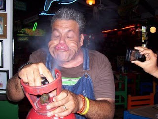 funny fridays photo of helium bottle gas escaping into mans face