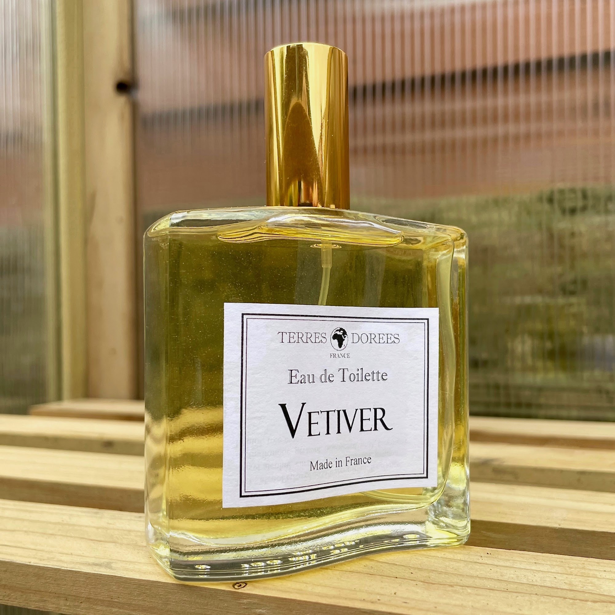 A bottle of Vetiver fragrance by Terre Dorees