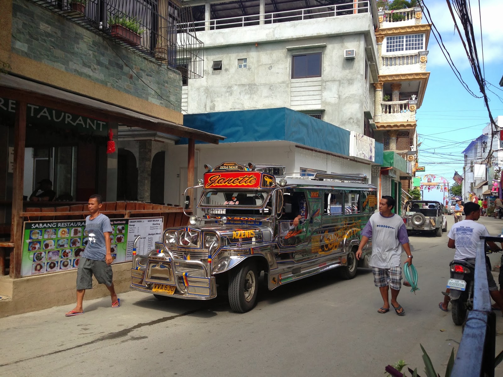 Janette the jeepney waits for a full load of passengers in Sabang ...