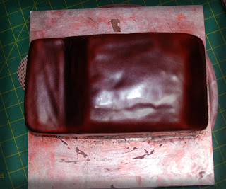 Real red velvet cake with no food colouring, cream cheese frosting to make an F250 birhday cake, carved, crumb coated, fondant covered trimmed, airbrushed with maroon and silver