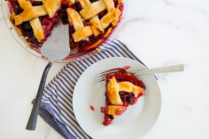 Cherry Berry Pie, slice on plate and full pie with slices missing