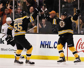 Milan Lucic scores a goal and celebrates