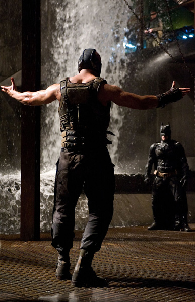 Bane (Tom Hardy) prepares to battle Batman (Christian Bale) in THE DARK KNIGHT RISES.