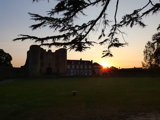 Sunrise at Tonbridge Castle - The sun peeks out from behind the Tourist Information Centre at Tonbridge Castle, seen from across Castle Lawn