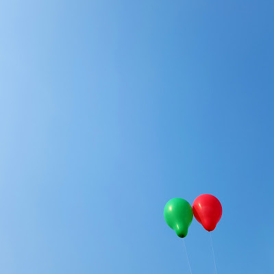 A Minimalist Photo of two balloons in the sky shot by Samsung Galaxy S6 Mobile Phone