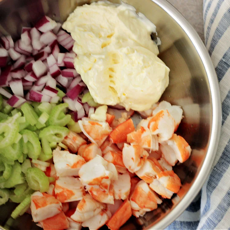 Process photo of ingredients for cold shrimp salad in bowl