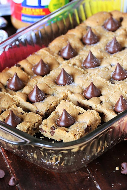 Peanut Butter Blossom Bars in Baking Dish Image