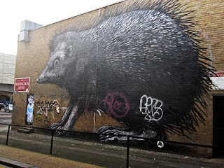 Graffiti urban street art hedgehog theme by Roa