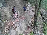 This is the narrow path we had to traverse the rock face of this cliff -- with our bikes