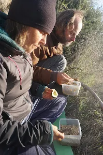Murielle and I eating in the high grass in warm clothes