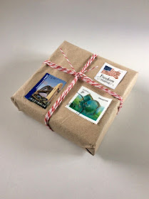 gift wrapping with twine, kraft paper, postage stamps, brown paper packages tied up with string, blah to TADA!