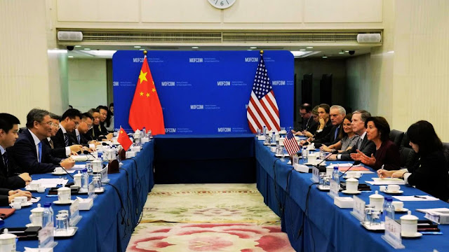 Cover Image Attribute: U.S. Commerce Secretary Gina Raimondo, right, speaks during a meeting with her Chinese counterpart Wang Wentao, left, at the Ministry of Commerce in Beijing, Aug. 28, 2023. / Source: AP