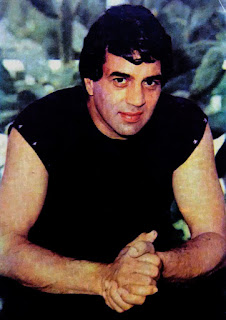actor dharmendra in sleeve less black t shirt with light smile
