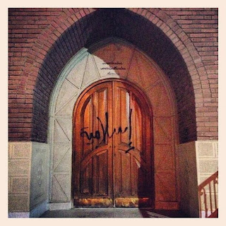 graffiti on church's doors 