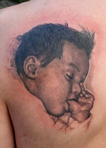Baby - already tattooed with a tear for doing time.
