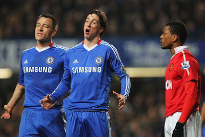 Fernando Torres and John Terry make their point with Patrice Evra